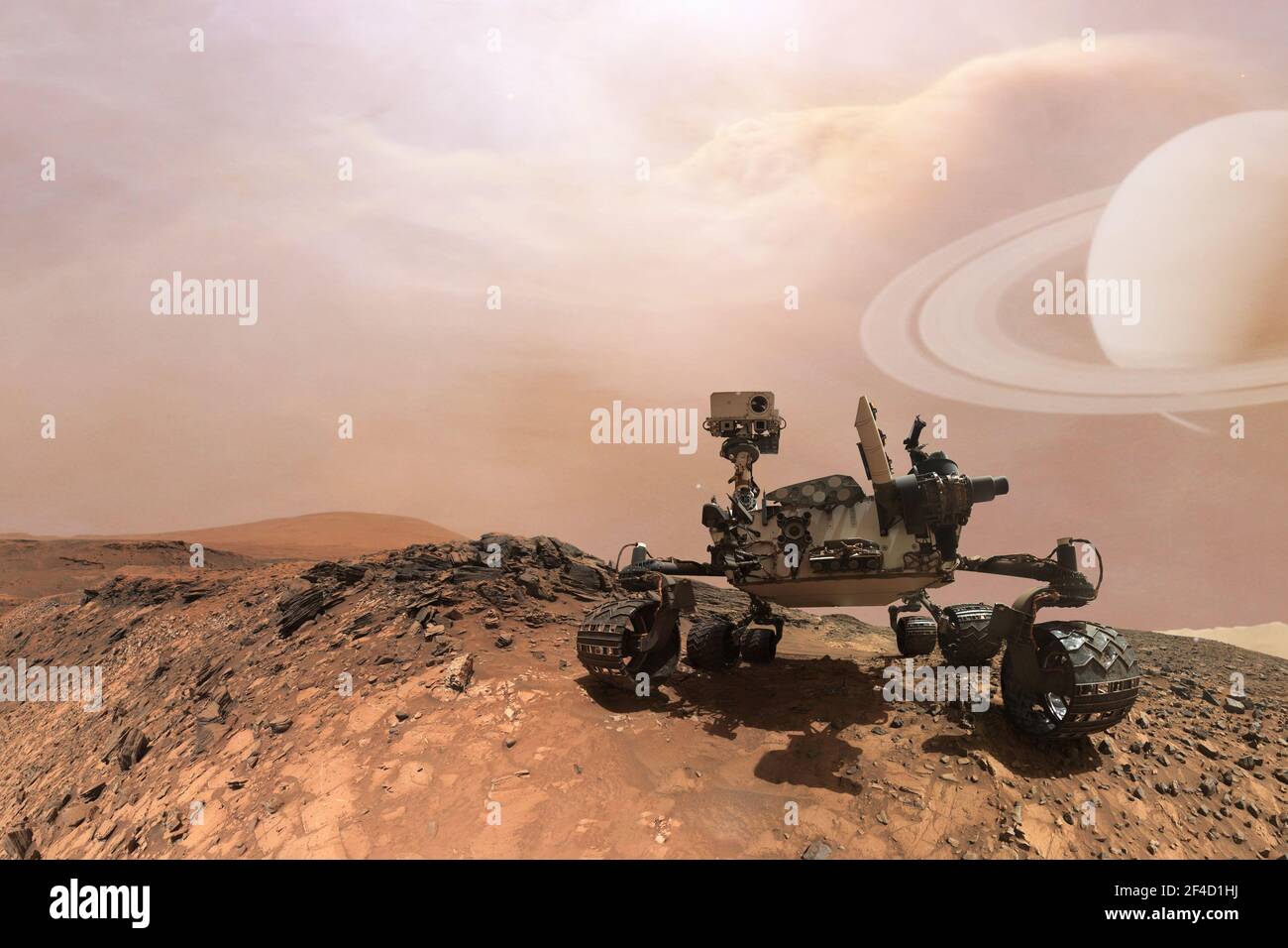 Curiosity Mars Rover exploring the surface of red planet. Elements of this image furnished by NASA. Stock Photo