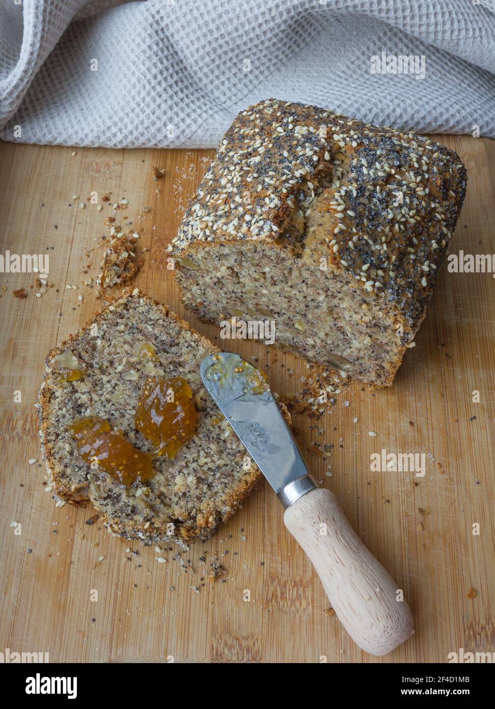 Whole grain banana bread, multigrain organic homemade bread on wooden background Stock Photo