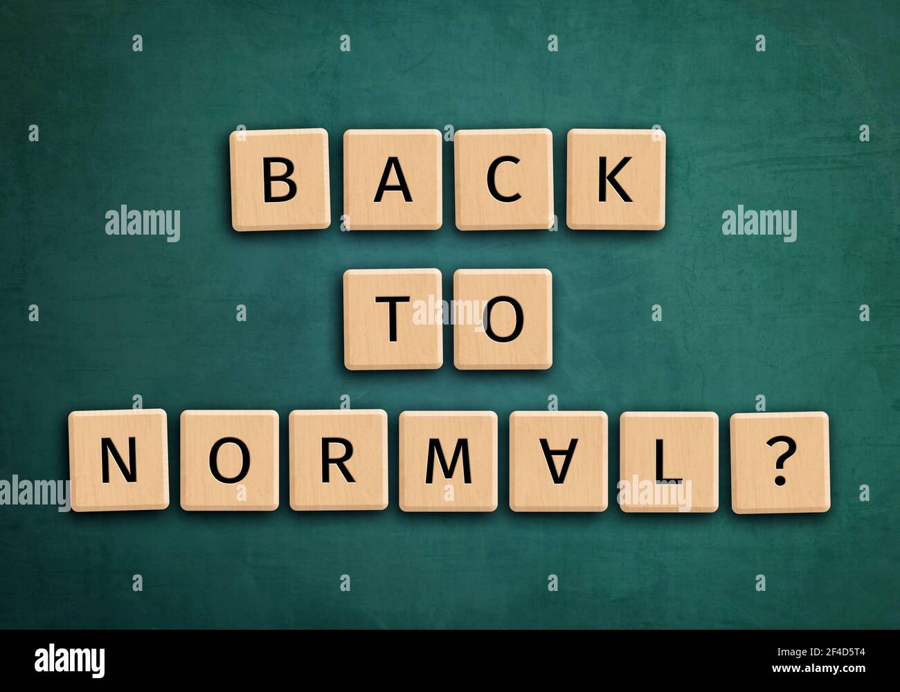 Back to normal letters on green chalkboard Stock Photo