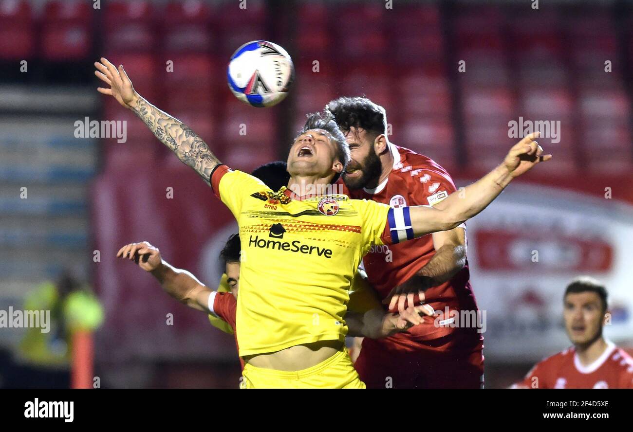 James Clarke of Walsall challenges for the ball with Joe McNerney of Crawley  during the Sky Bet League Two match between Crawley Town and Walsall at the People's Pension Stadium   , Crawley ,  UK - 16th March 2021 - Editorial Use Only Stock Photo