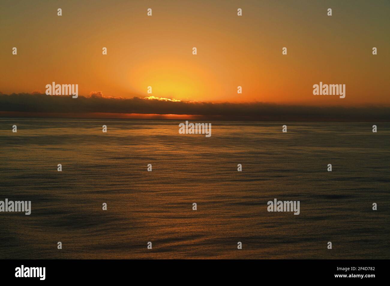 sunrise over ocean Stock Photo - Alamy