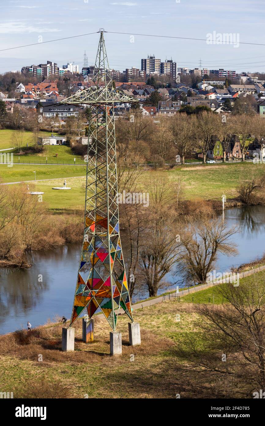 Leuchtturm, lighthouse, electricity pylon with colourful plexiglass panels on the banks of the river Ruhr, Essen-Horst at the back, Essen, Germany Stock Photo