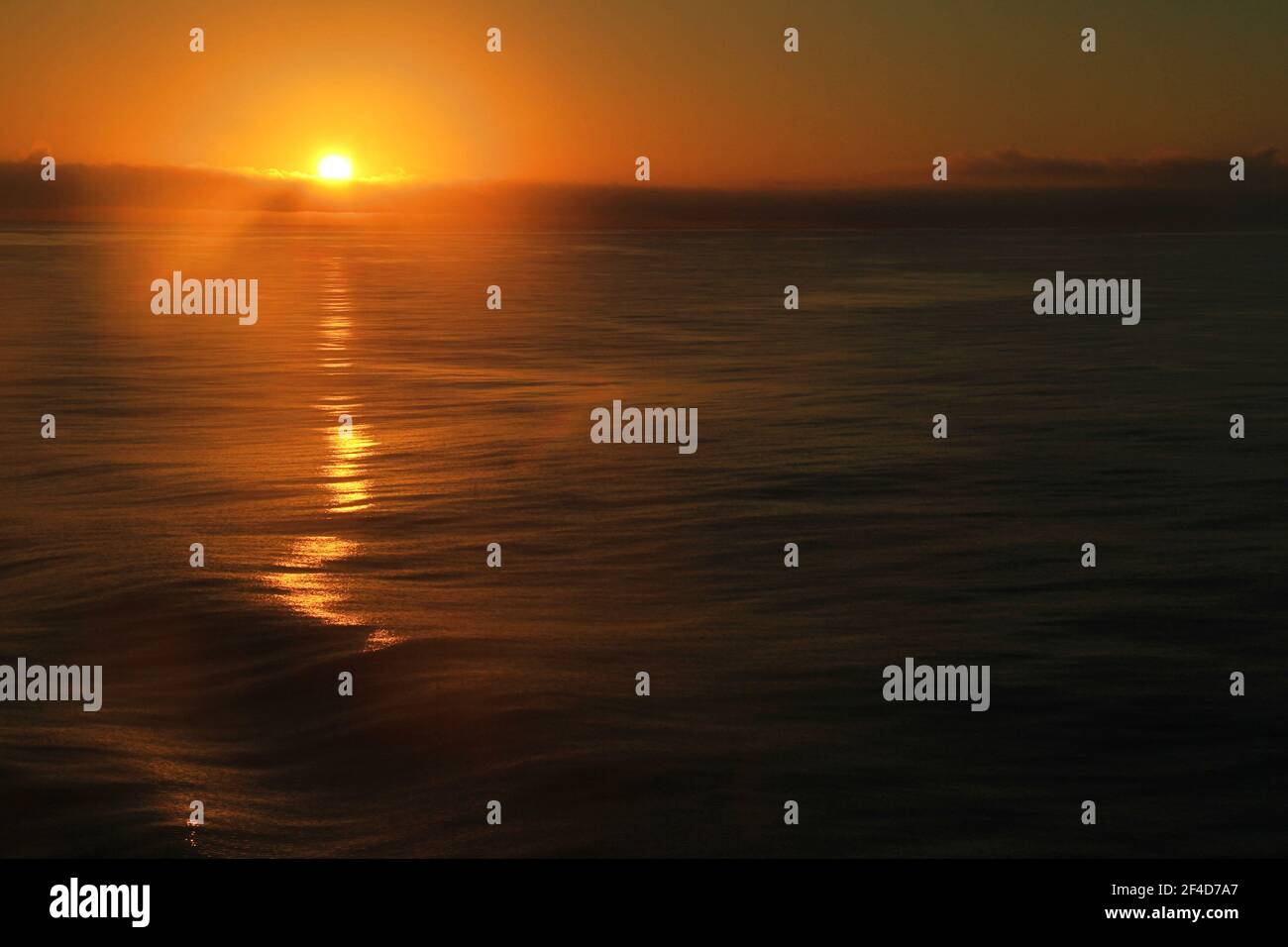 sunrise over ocean Stock Photo - Alamy