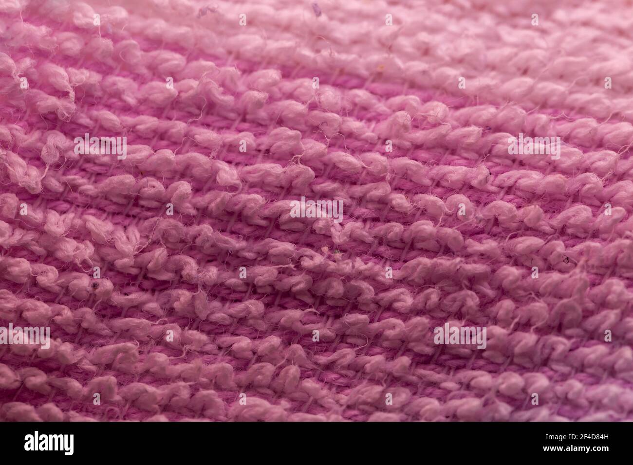 Pink Knitted Synthetic Fabric Background Stock Photo