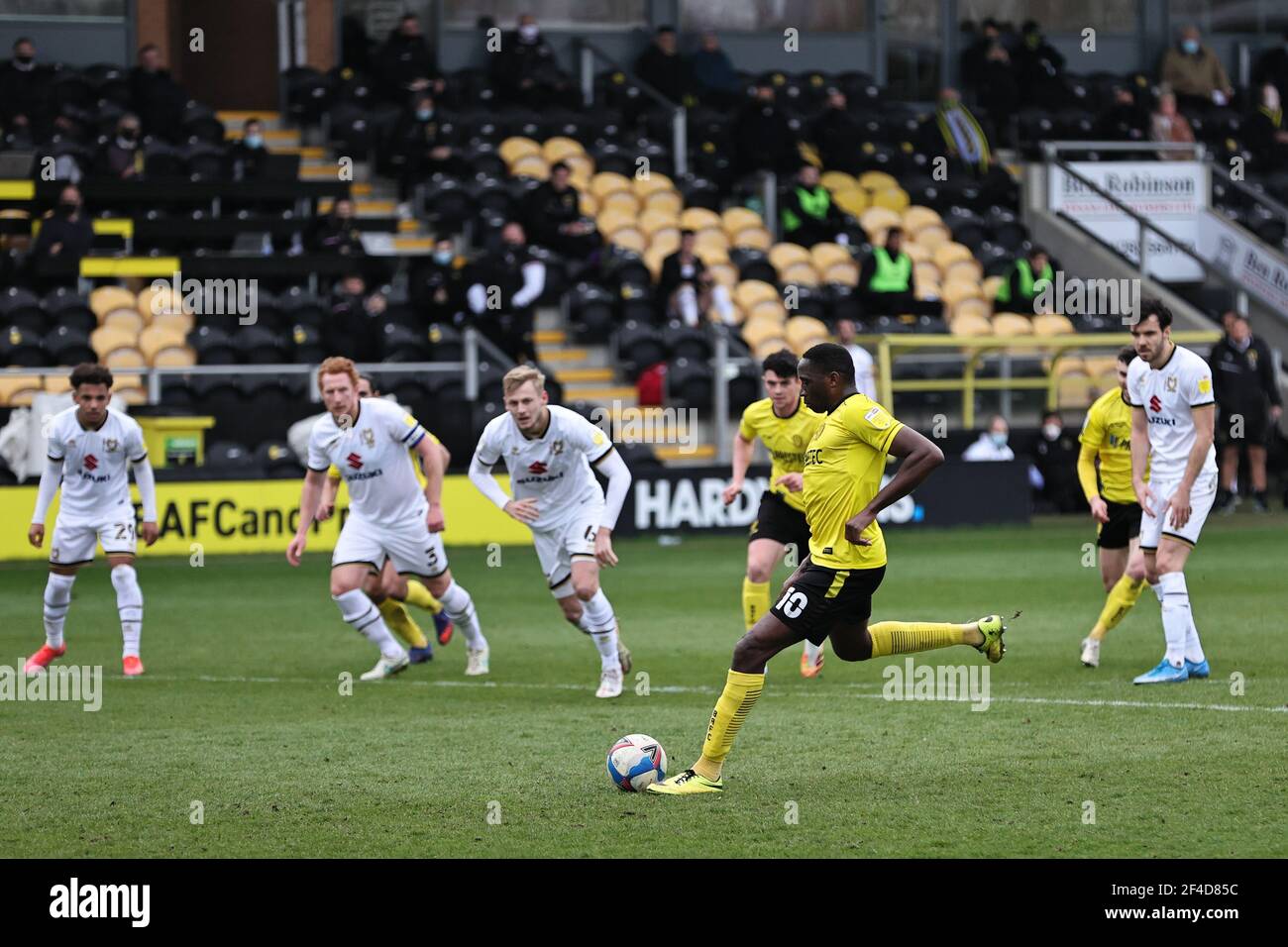 BURTON ON TRENT, UK. MARCH 20TH. Lucas Akins of Burton Albion scores from  the penalty spot during the Sky Bet League 1 match between Burton Albion  and MK Dons at the Pirelli