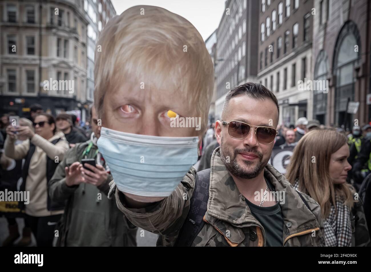 London, UK. 20th March, 2021. Coronavirus: Thousands of anti-lockdown demonstrators march under heavy police surveillance from Hyde Park to Westminster. Credit: Guy Corbishley/Alamy Live News Stock Photo