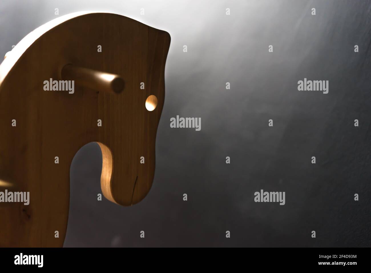 handmade wooden horse toy for children at the dark wall, copy paste ...