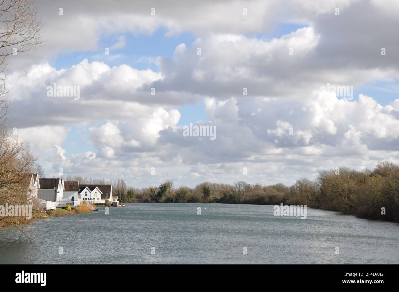 Houses by a beautiful lake in South Cerney Stock Photo