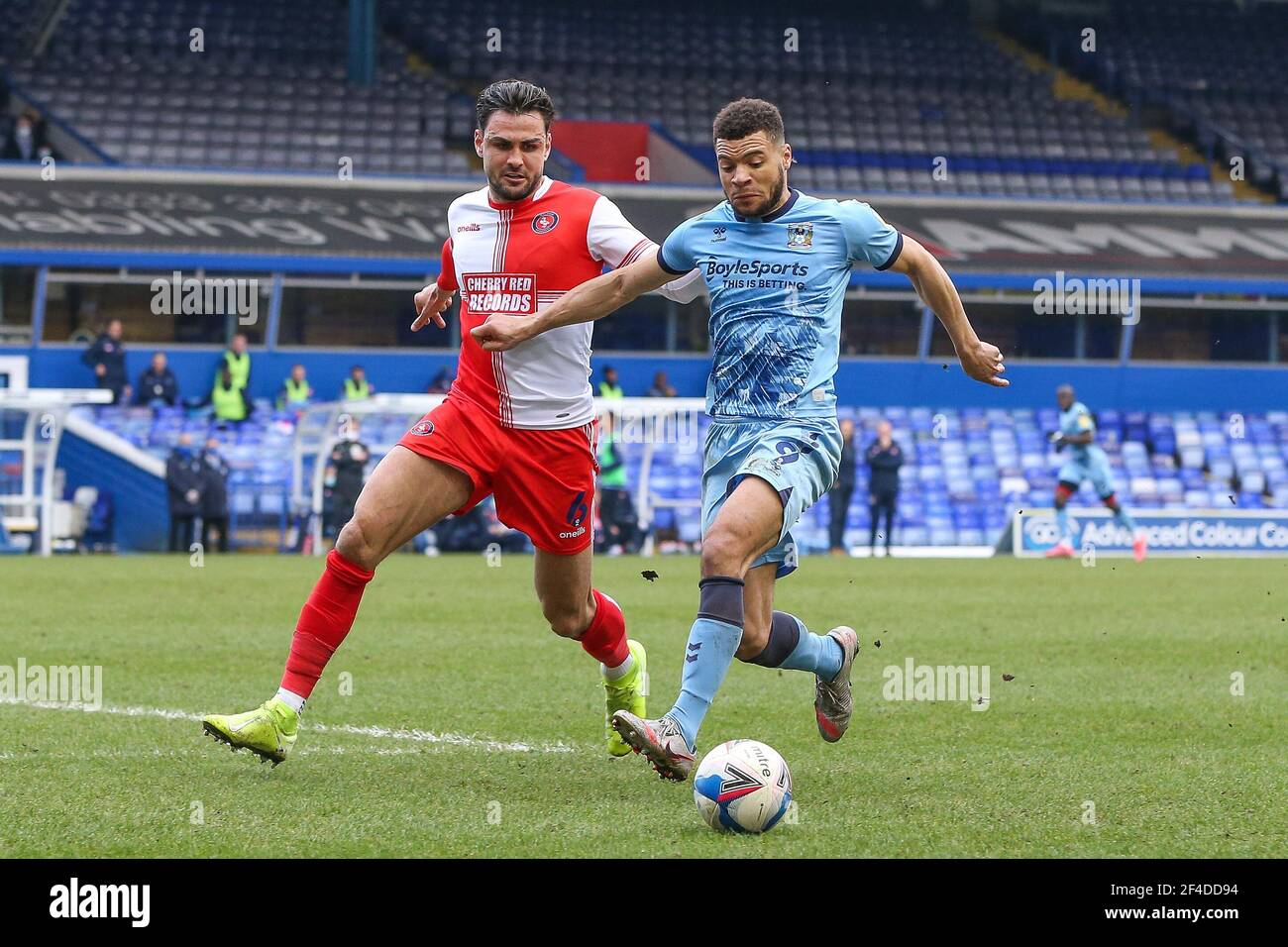 Birmingham, UK. 20th Mar, 2021. Maxime Biamou #9 of Coventry City dribbles the ball whilst under pressure from Ryan Tafazolli #6 of Wycombe Wanderers in Birmingham, UK on 3/20/2021. (Photo by Simon Bissett/News Images/Sipa USA) Credit: Sipa USA/Alamy Live News Stock Photo