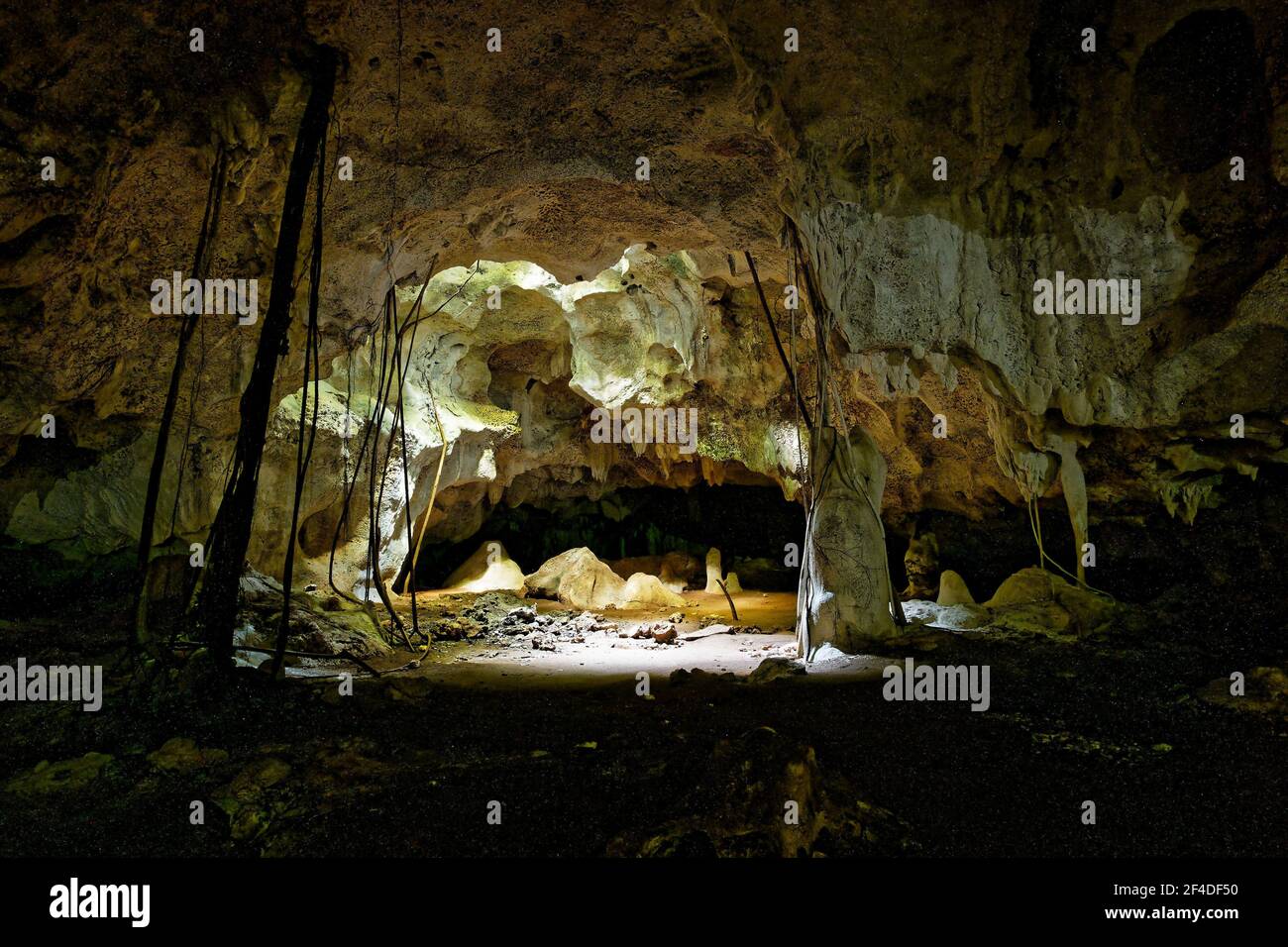 Kiwengwa Caves on Zanzibar island in Tanzania, worship locals ancestors, gifts to the holy stones, stalagmites and stalactites formed by water dissolv Stock Photo