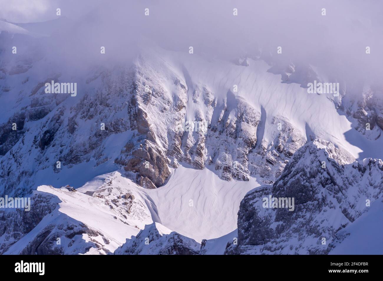 Clouds over alpine Mountain peaks, Switzerland Stock Photo