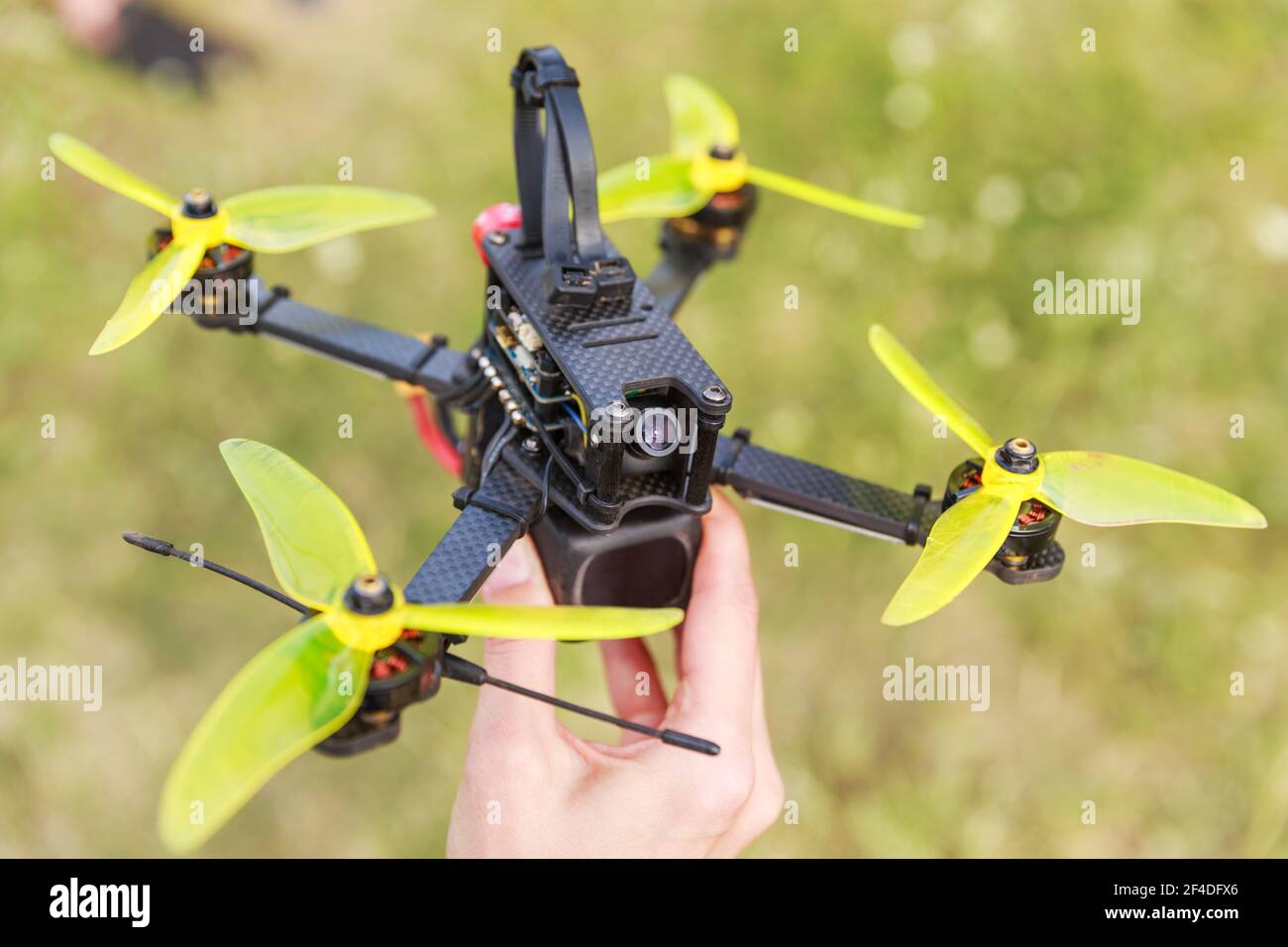 A fpv high-speed racing drone copter lying on a hand Stock Photo - Alamy