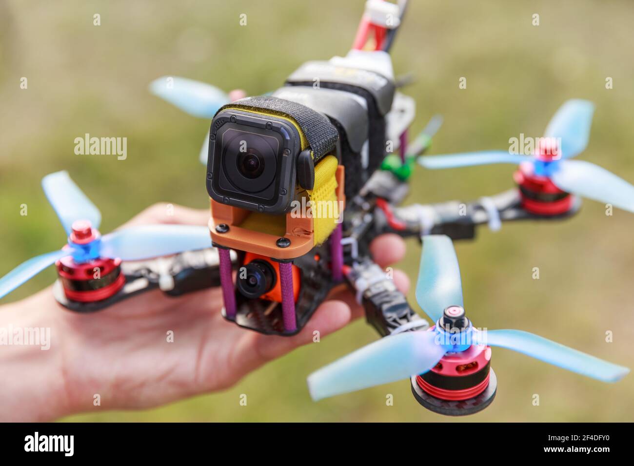 A fpv high-speed racing drone copter lying on a hand Photo -