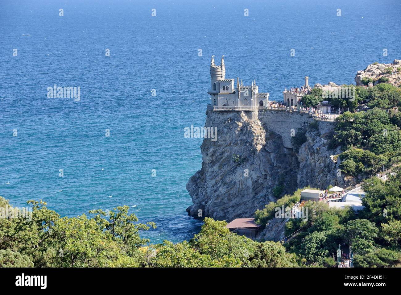 = Swallow’s Nest Castle on the Aurora Cliff =  View from observation platform at Alupkinskoye highway on the decorative castle “Swallow Nest” rising o Stock Photo