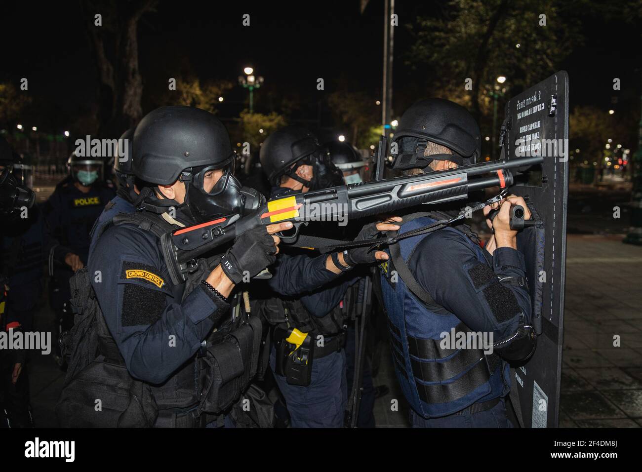 Bangkok, Thailand. 20th Mar, 2021. Riot police aims rubber bullet gun during the demonstration