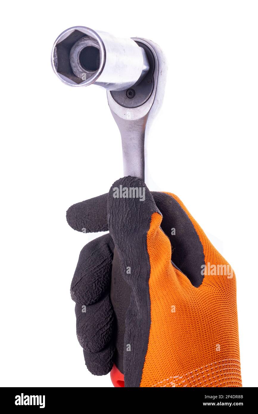 A socket wrench with a ratchet in the hand. Accessories for mechanics used in mechanical work. Light background. Stock Photo