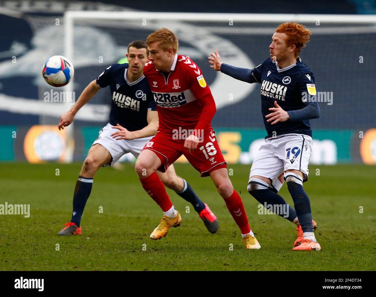 LONDON, United Kingdom, MARCH 20: L-R Murray Wallace of Millwall, Duncan Watmore of Middlesbrough and Ryan Woods of Millwall during The Sky Bet Championship between Millwall and Middlesbrough at The Den Stadium, London on 20th March 2021 Credit: Action Foto Sport/Alamy Live News Stock Photo