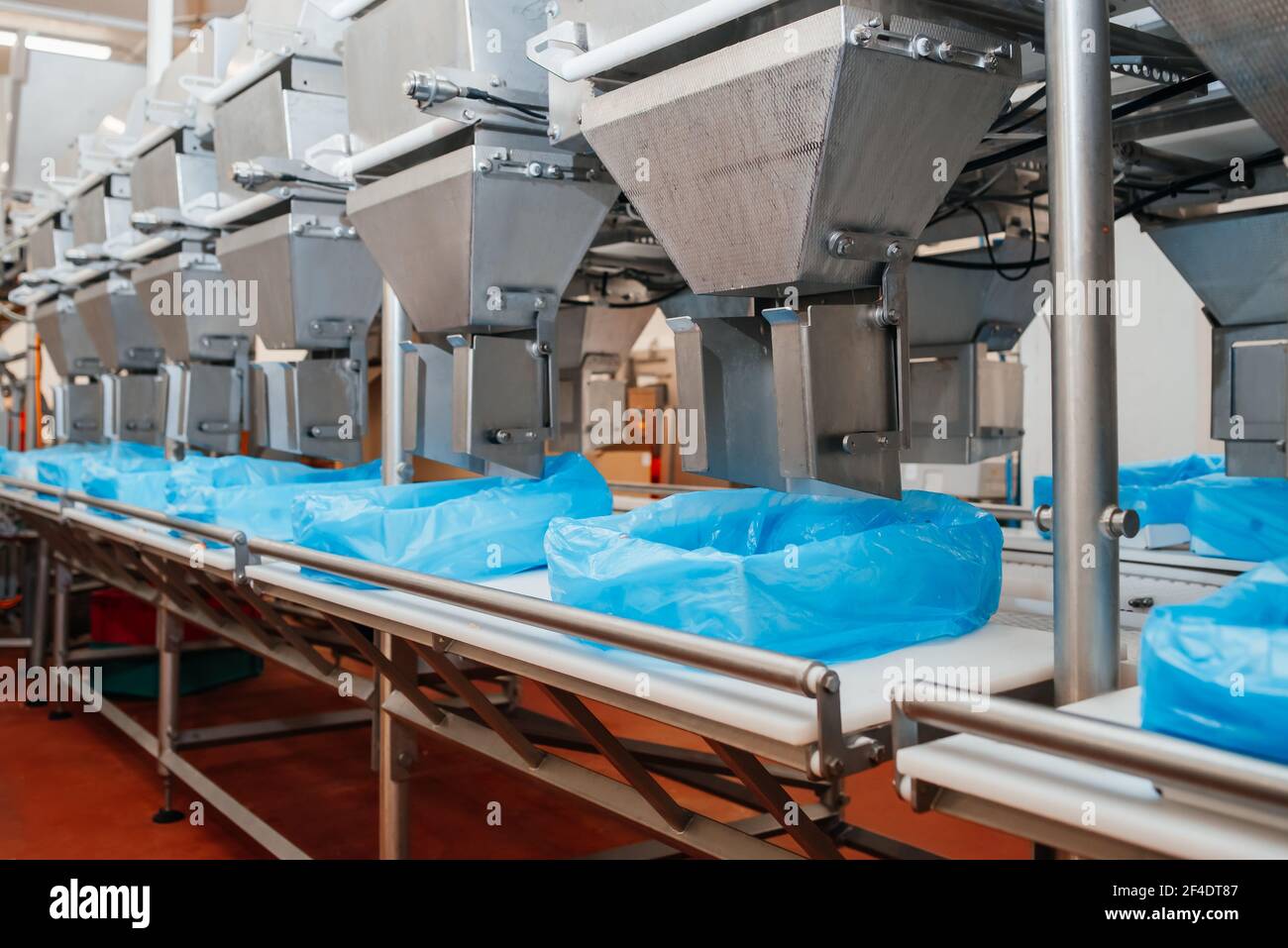 Meat processing plant. Production line of meat.Line for the production of meat with packaging and cutting . Industrial equipment at a meat factory Photo - Alamy