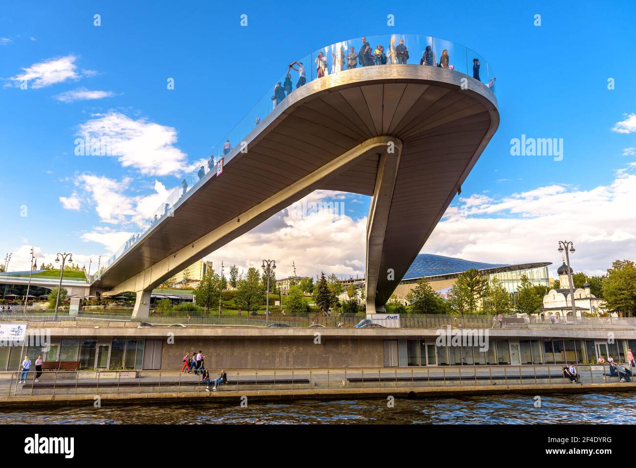 Moscow - Aug 21, 2020: Floating bridge in Zaryadye Park, Moscow, Russia. This place is famous tourist attractions of city. People stand on amazing urb Stock Photo
