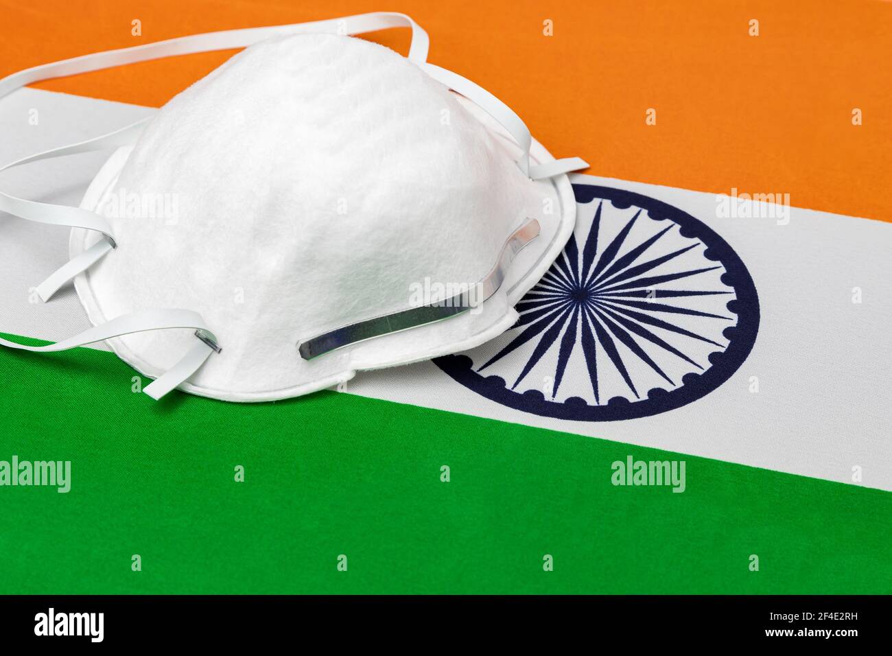 India flag and N95 face mask. Concept of Covid-19 coronavirus lockdown, travel ban and healthcare crisis Stock Photo