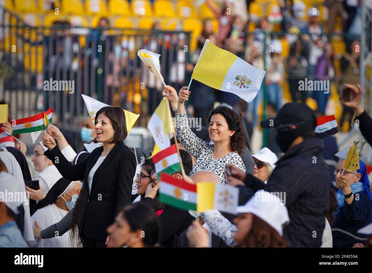 Erbil, Iraq. Faithful welcome Pope Francis at Erbil Stadium. Credit: MLBARIONA Stock Photo