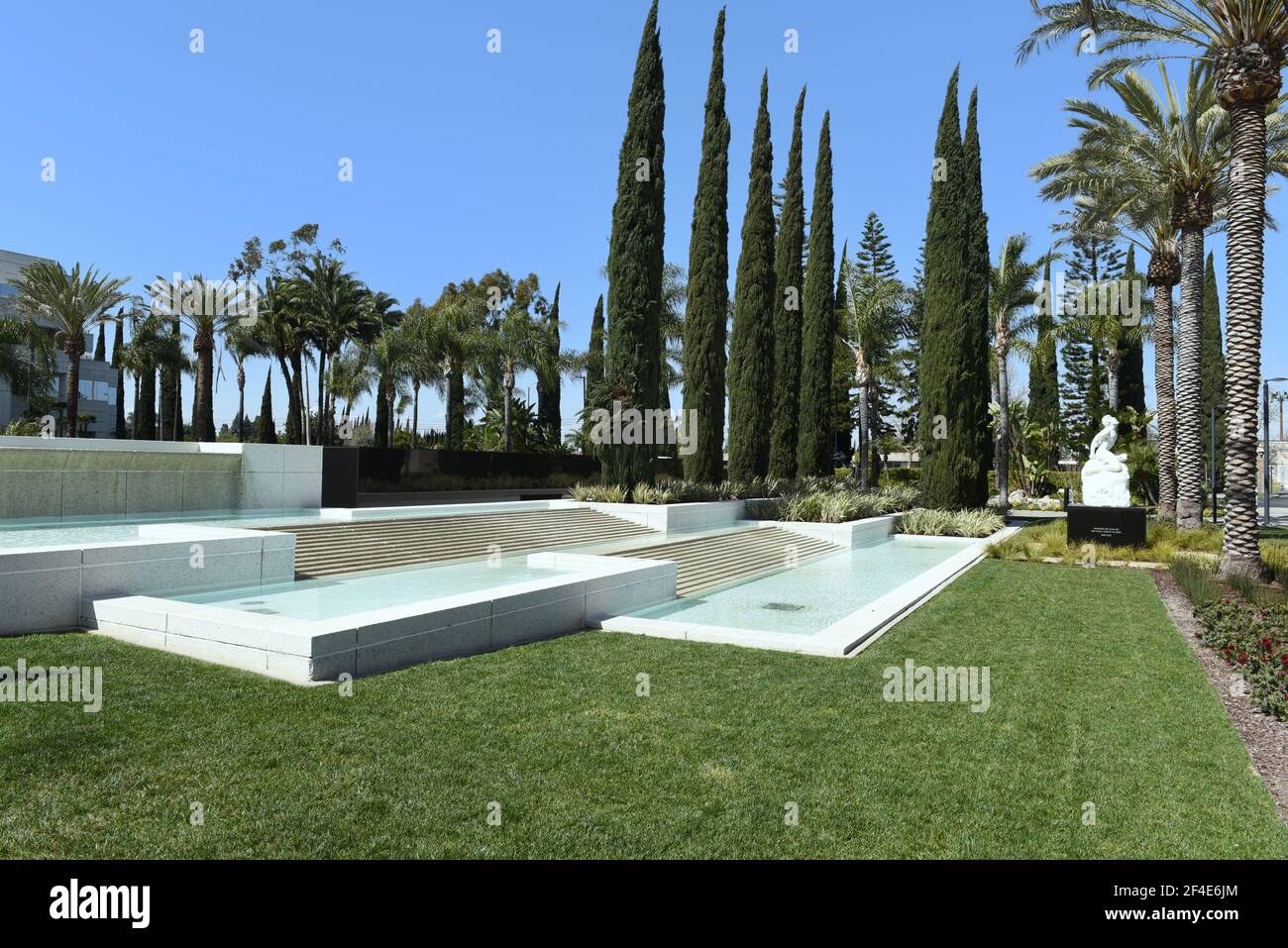 GARDEN GROVE, CALIFORNIA - 20 MAR 2021: Pool and Fountain at the Crystal Cathedral with statue of Job. Stock Photo