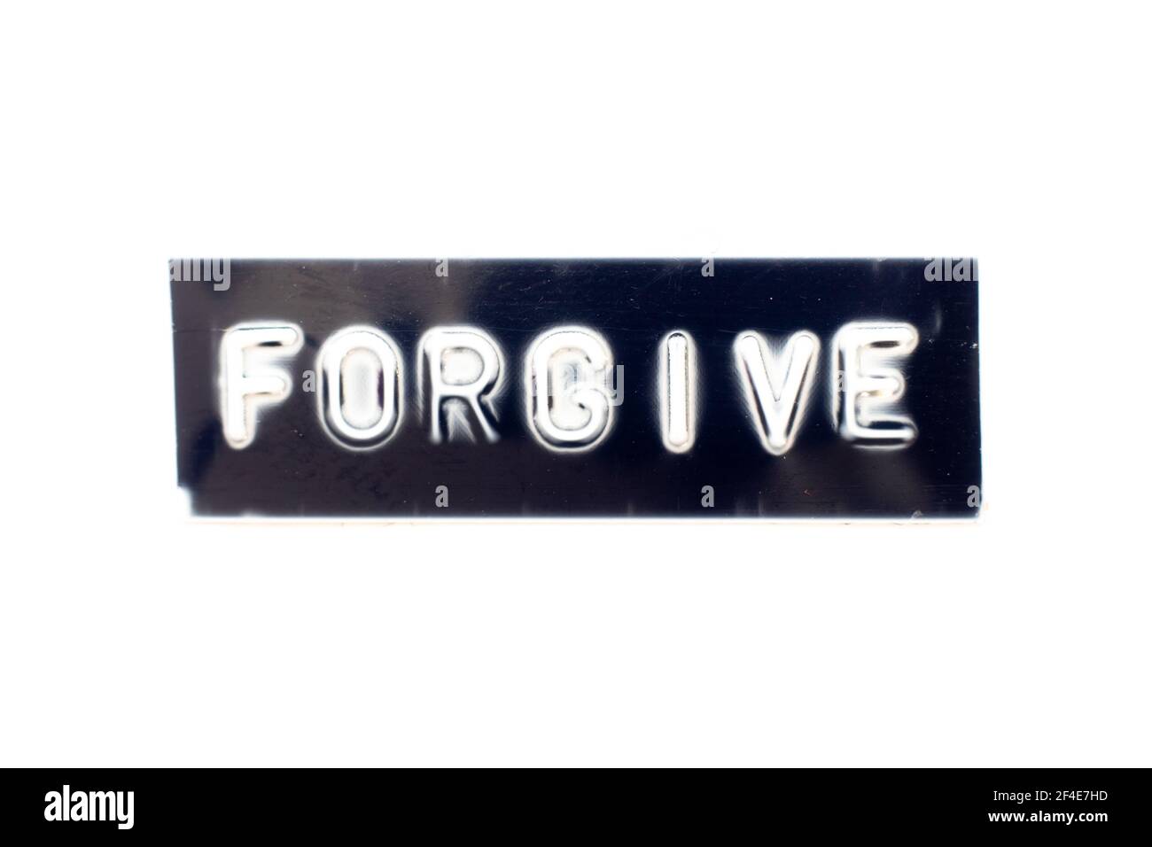 Embossed letter in word forgive on black banner with white background Stock Photo