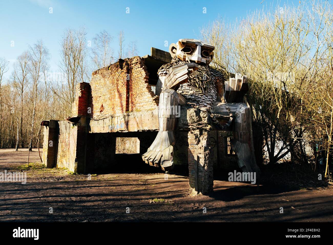 (210321) -- BOOM, March 21, 2021 (Xinhua) -- Photo taken on March 20, 2021 shows a 'troll' at the De Schorre forest park in Boom, Belgium. Danish artist Thomas Dambo and his team built seven giant 'trolls' from reclaimed wood at the De Schorre forest park in northern Belgium in 2019. These giant wooden sculptures are dotted around the forest. The United Nations General Assembly proclaimed March 21 as the International Day of Forests which celebrates and creates awareness on the importance of all types of forests and on the need to preserve and care for the world's woodlands. This year the Stock Photo