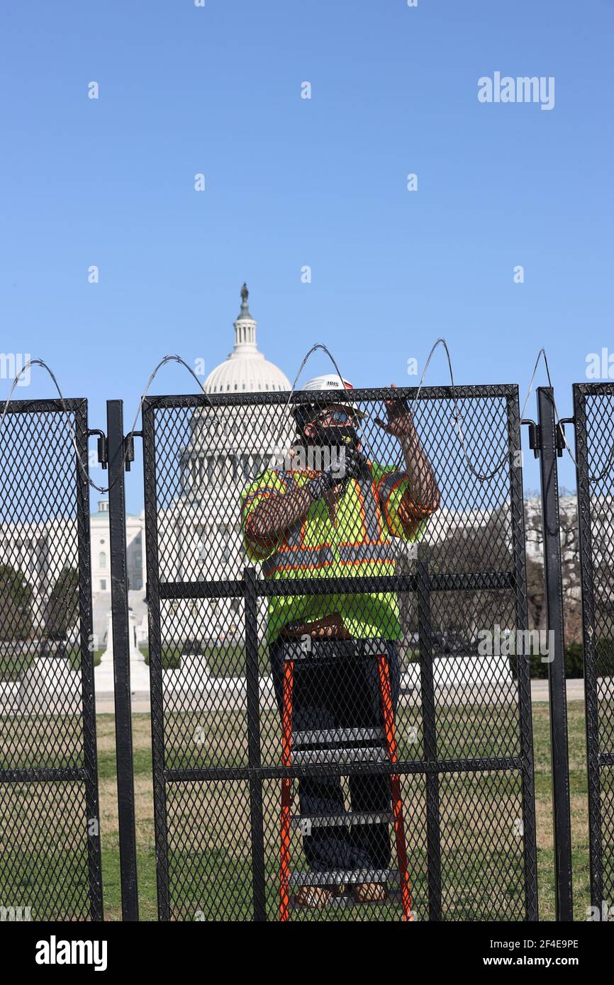 Capitol Razor Wire Washington, DC, USA. 20th Mar, 2021. Workers remove fencing on and ...
