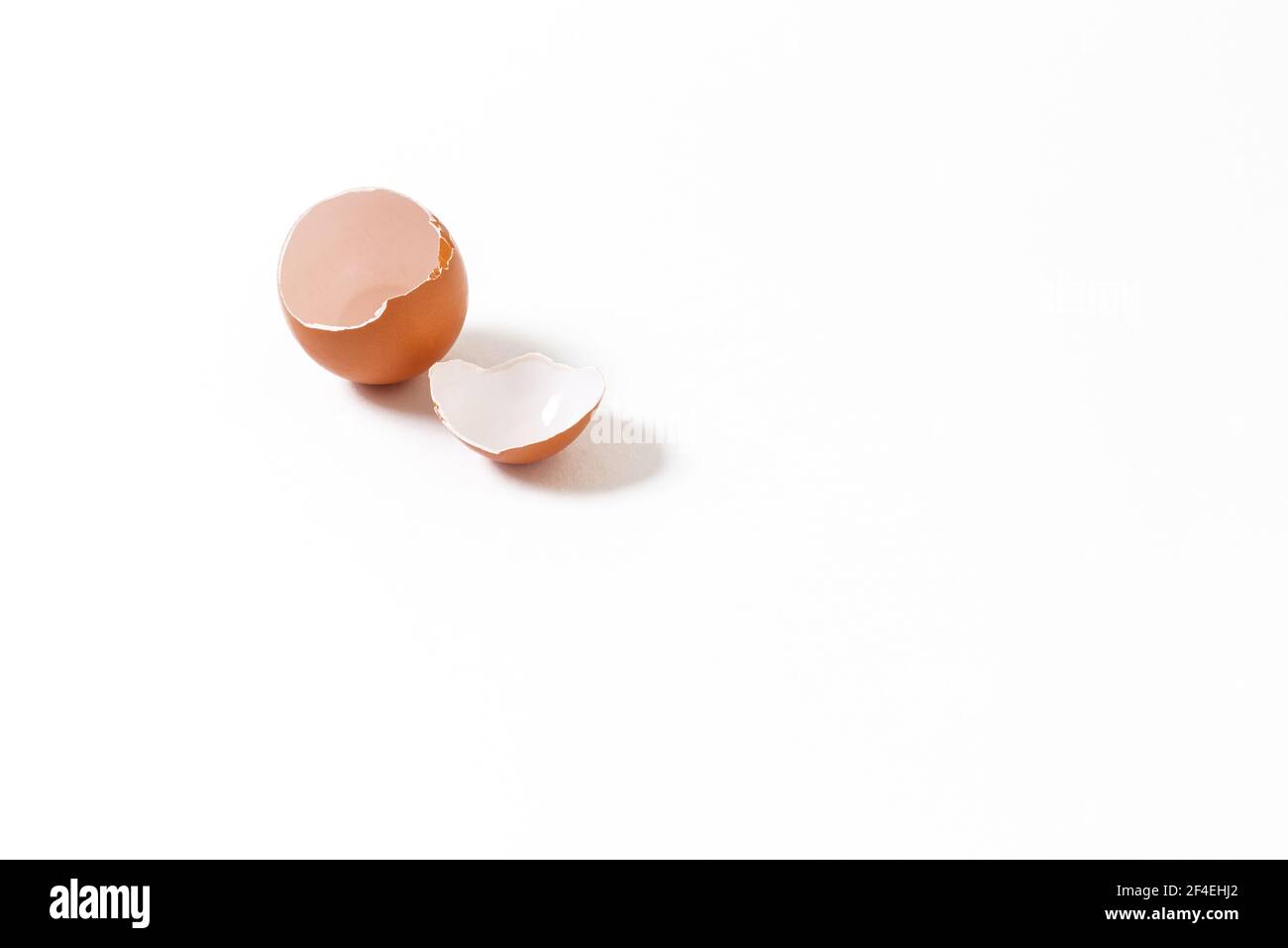 Broken chicken egg isolated on white background Stock Photo - Alamy
