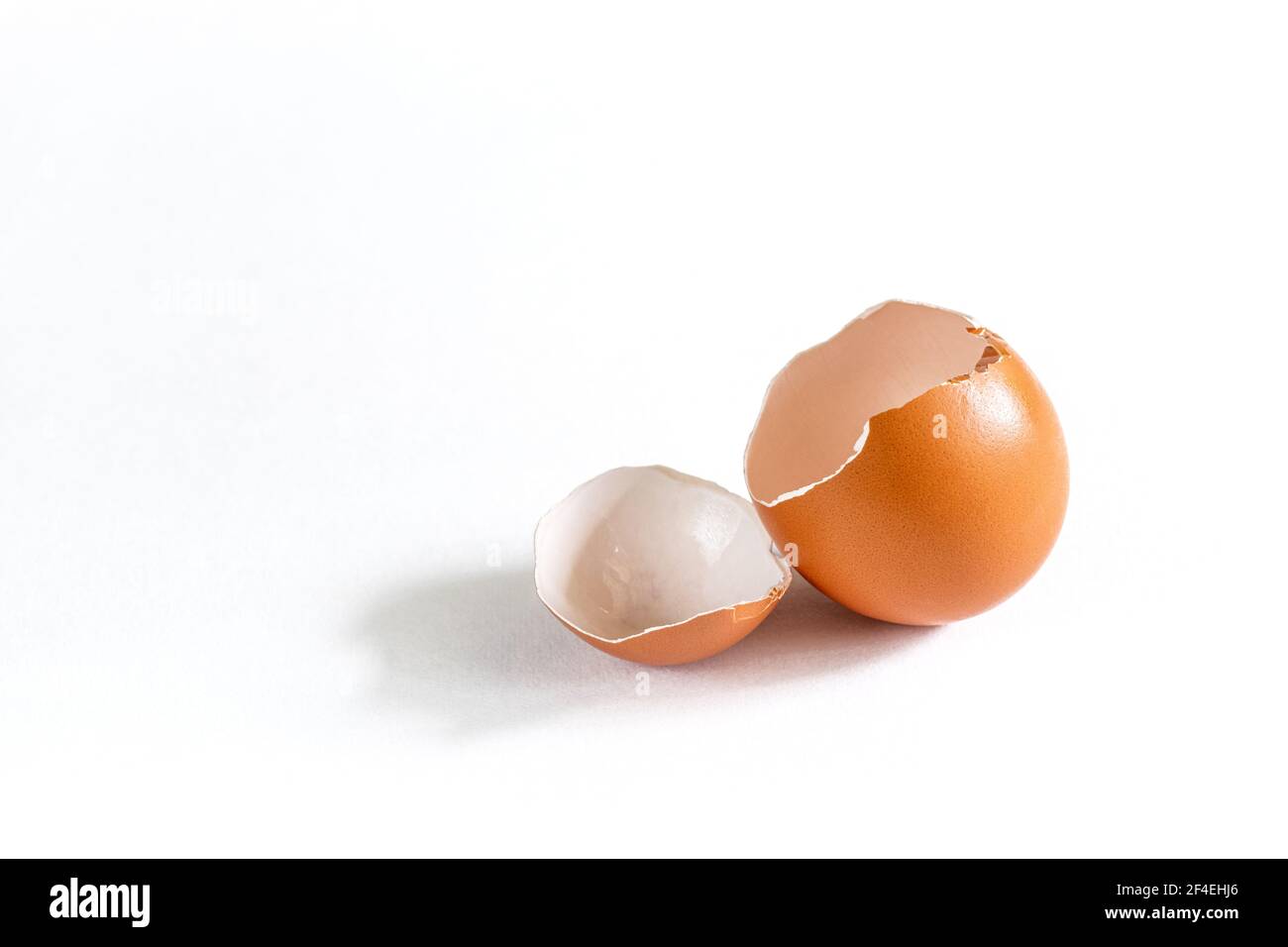 Broken chicken egg isolated on white background Stock Photo - Alamy