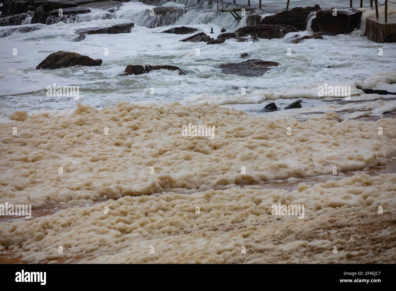 Sydney, sea foam on Avalon Beach during the floods in New South Wales in March 2021,NSW,Australia Stock Photo