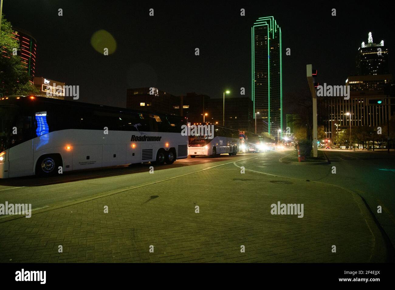 Dallas, Texas, USA. 20th Mar, 2021. Several charter buses carrying migrant teenagers arrived under Federal Protective Service escort to the Kay Bailey Hutchison Convention Center in Dallas on Saturday evening, March 21, 2021.The emergency intake site was opened Wednesday and is expected to hold nearly 3,000 teens, according to the Human and Health Services department. The site in Dallas and one in Midland TX have been opened to alleviate overcrowding at Border Patrol facilities and other HHS-run shelters.The current agreement is for 75 days and allows the use of space at the Kay Bailey Hutchi Stock Photo