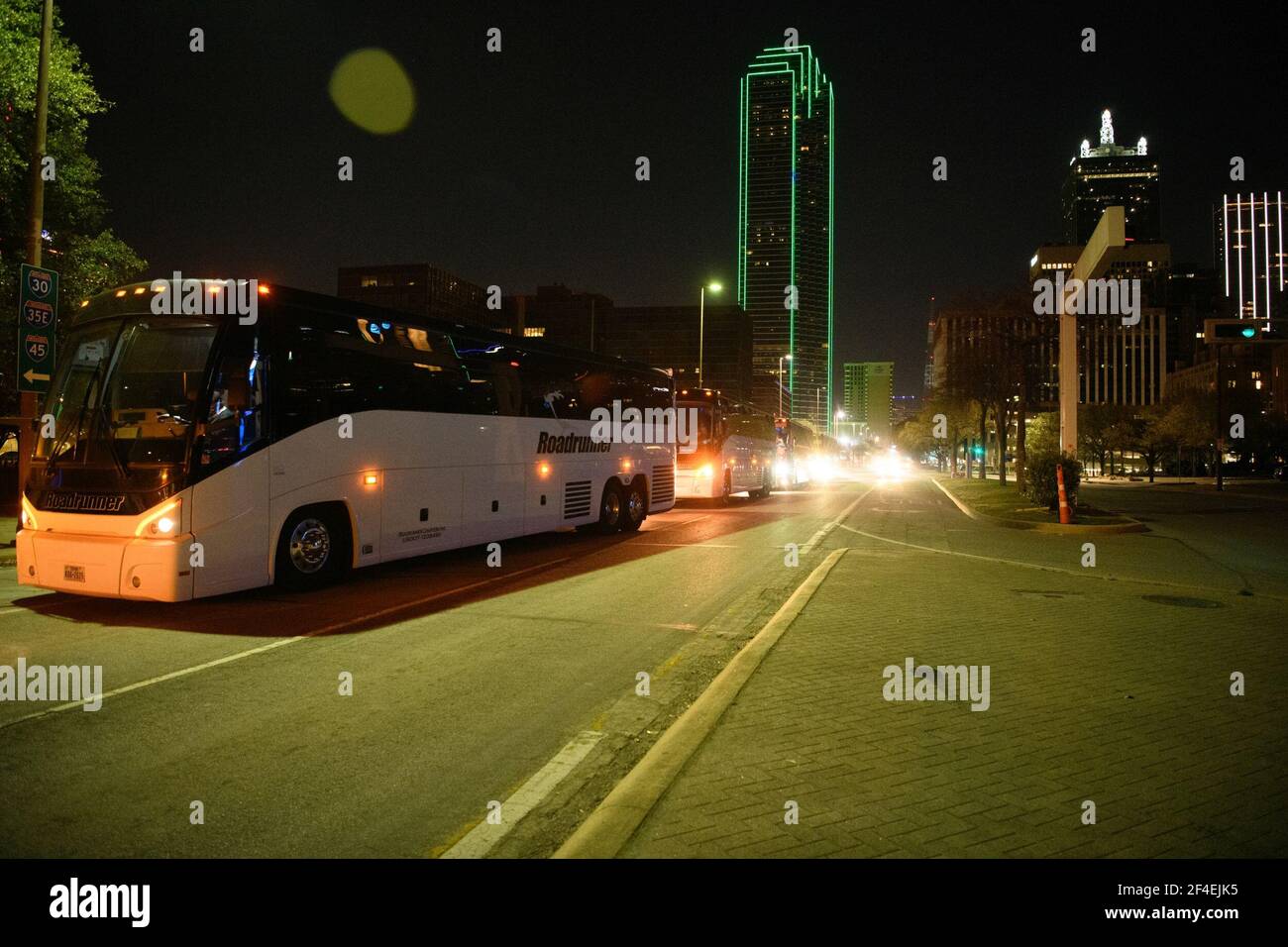 Dallas, Texas, USA. 20th Mar, 2021. Several charter buses carrying migrant teenagers arrived under Federal Protective Service escort to the Kay Bailey Hutchison Convention Center in Dallas on Saturday evening, March 21, 2021.The emergency intake site was opened Wednesday and is expected to hold nearly 3,000 teens, according to the Human and Health Services department. The site in Dallas and one in Midland TX have been opened to alleviate overcrowding at Border Patrol facilities and other HHS-run shelters.The current agreement is for 75 days and allows the use of space at the Kay Bailey Hutchi Stock Photo