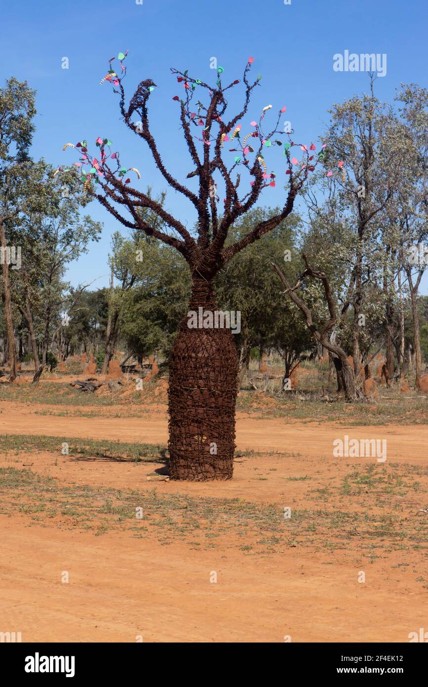 Scrap metal sculpture of a boab or bottle tree with birds near Aramac, outback Queensland, Australia on the Lake Dunn sculpture trail created for tour Stock Photo