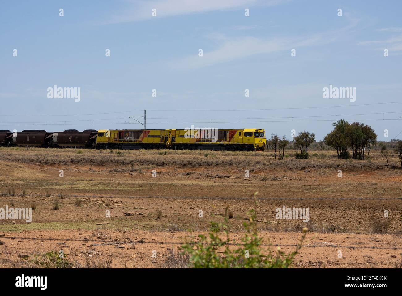 Two electric train engines hauling loaded coal wagons to the coast in Central Queensland, Australia Stock Photo