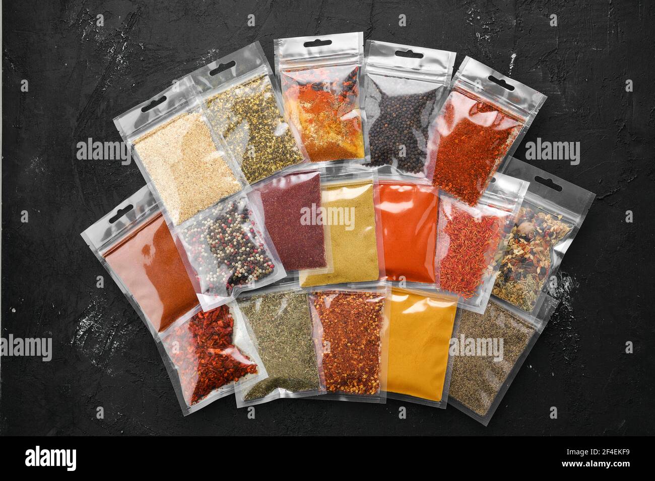 Overhead view of different spices in plastic package Stock Photo