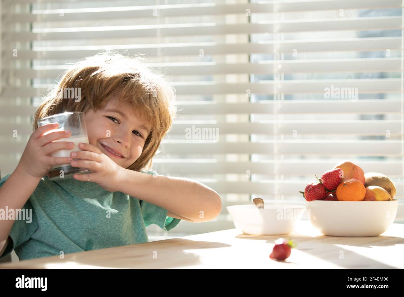 Kid eating breakfast. Child eating healthy food. Healthy nutrition for kids. Stock Photo