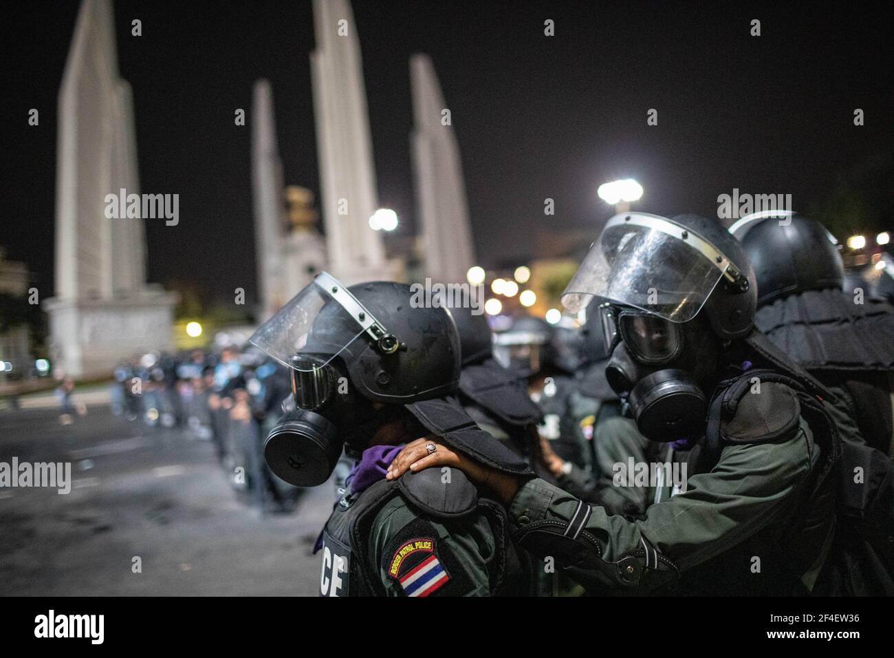 Riot police officers wearing gas mask stand guard near the Democracy Monument during an anti-government demonstration in Bangkok. Thousands of pro-democracy protesters gathered near the Grand Palace in Sanam Luang demanding the resignation of Thailand Prime Minister and the reform of the monarchy. The protesters also denounced the use of the Lese Majeste law under the section 112 of the penal code. The protest organized by REDEM (Restart Democracy) ended up with several clashes, the use of water cannon, tear gas and rubber bullet, which had left several injured. (Photo by Geem Drake / SOPA Ima Stock Photo