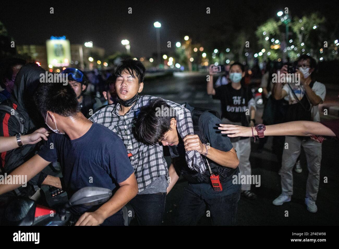 Pro democracy protesters help an injured protester to get out to a safer place during an anti-government demonstration in Bangkok. Thousands of pro-democracy protesters gathered near the Grand Palace in Sanam Luang demanding the resignation of Thailand Prime Minister and the reform of the monarchy. The protesters also denounced the use of the Lese Majeste law under the section 112 of the penal code. The protest organized by REDEM (Restart Democracy) ended up with several clashes, the use of water cannon, tear gas and rubber bullet, which had left several injured. (Photo by Geem Drake / SOPA Im Stock Photo