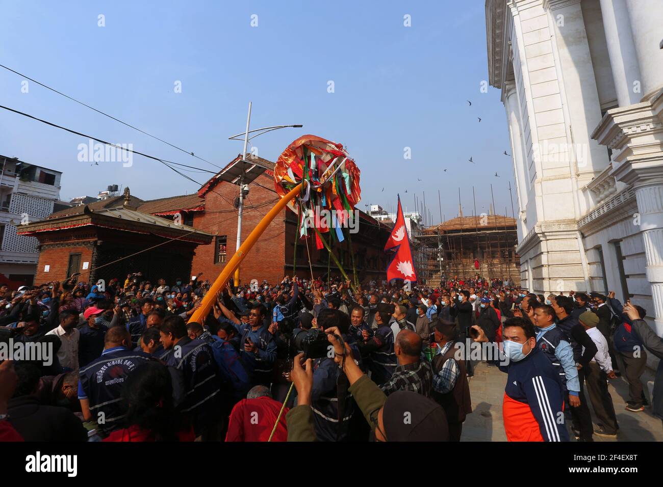 Kathmandu, Bagmati, Nepal. 21st Mar, 2021. Nepali people hoist a