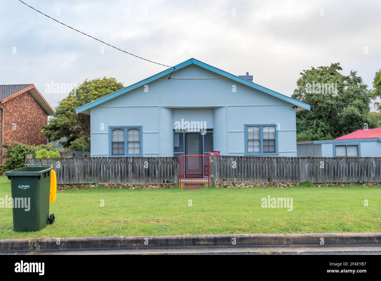 A very blue home in the New South Wales, south coast township of Bermagui. The house is built using fibrous cement sheeting, known locally as Fibro. Stock Photo