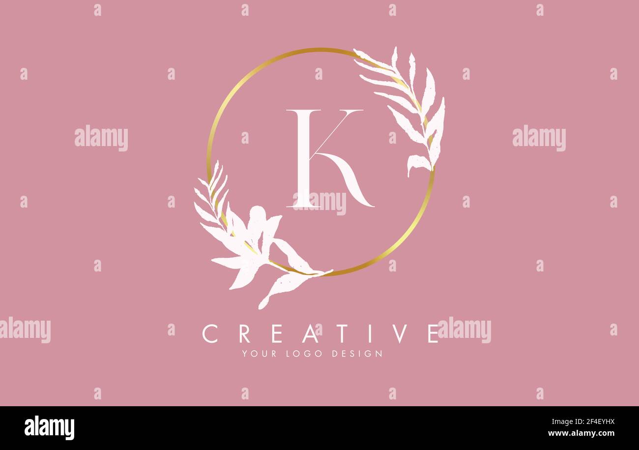 K Letter logo design with golden circles and white leaves on branches ...