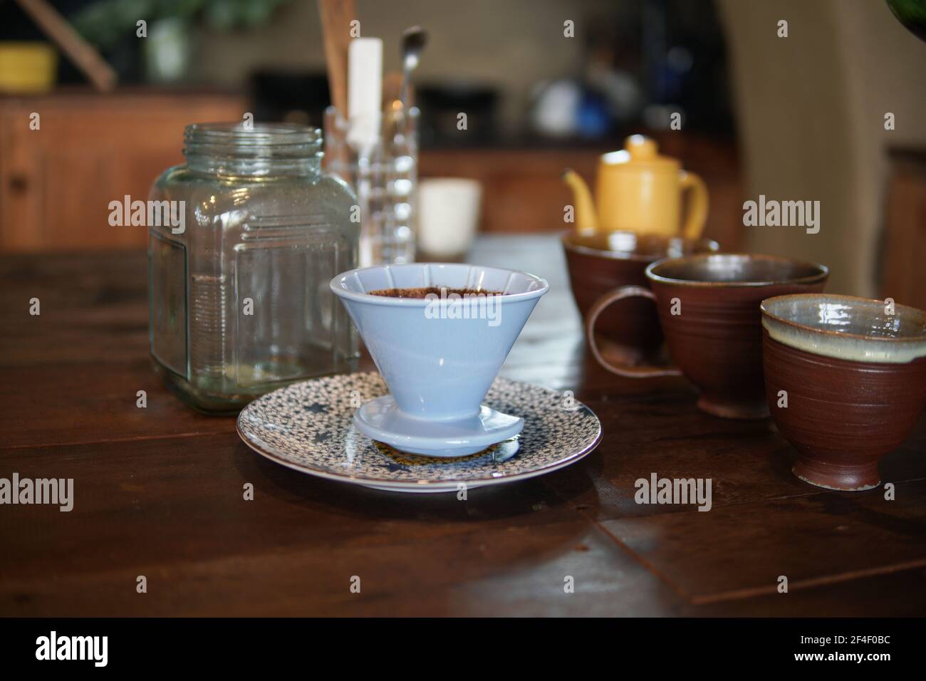 preparing brewing coffee with coffee maker and drip kettle. Dripping