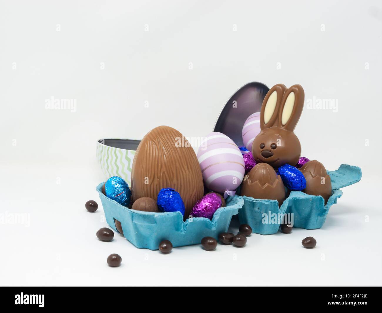 Chocolate Easter eggs with a happy chocolate Easter bunny in an egg