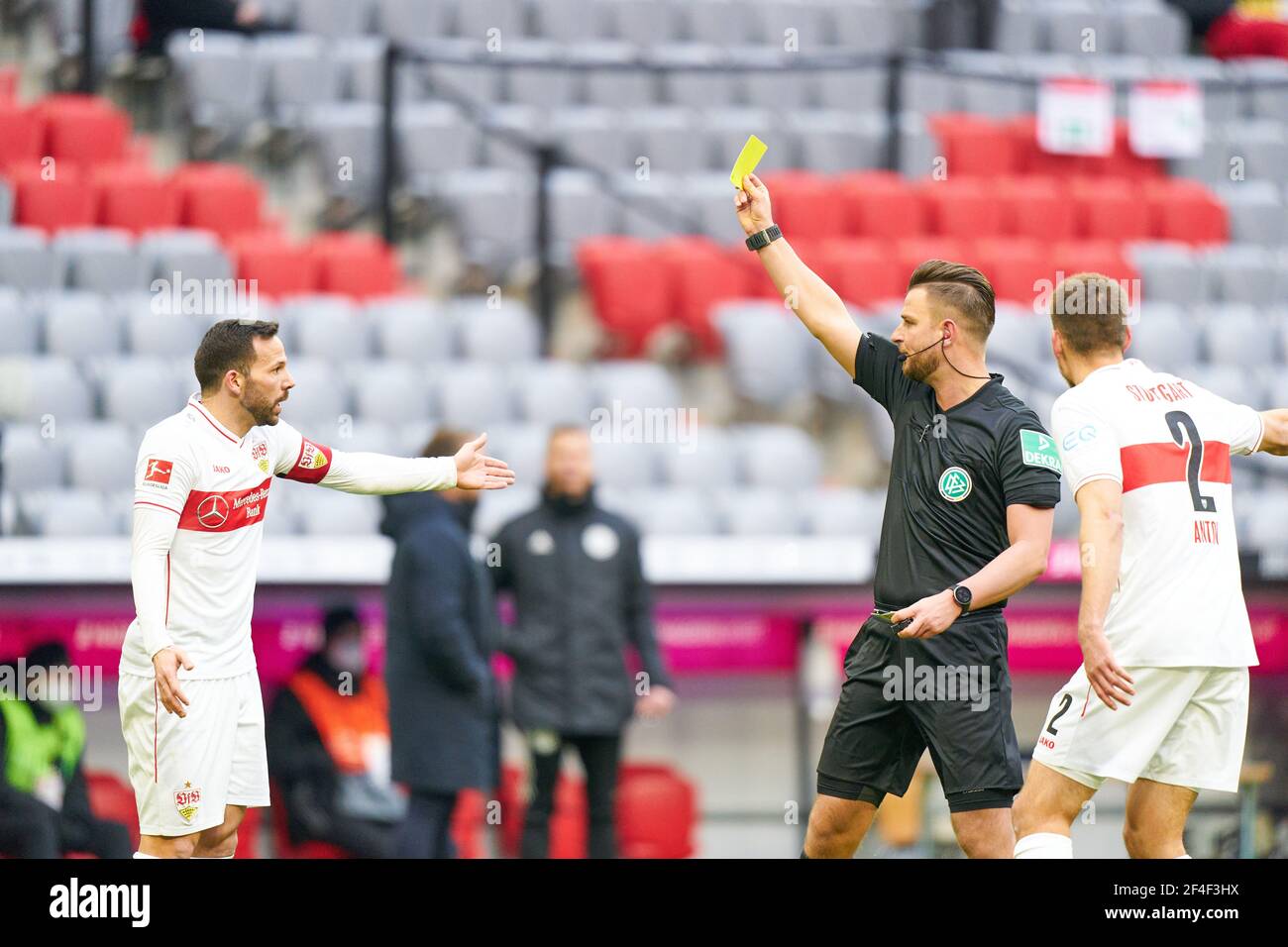 Munich, Germany. 20th Mar, 2021. Referee Daniel SCHLAGER with whistle, gestures, shows, watch, individual action, Schiedsrichter, Hauptschiedsrichter, shows the Yellow Card to Gonzalo CASTRO, VFB 8 in the match FC BAYERN MUENCHEN - VFB STUTTGART 4-0 1.German Football League on March 20, 2021 in Munich, Germany Season 2020/2021, matchday 26, 1.Bundesliga, FCB, München, 26.Spieltag Credit: Peter Schatz/Alamy Live News Stock Photo