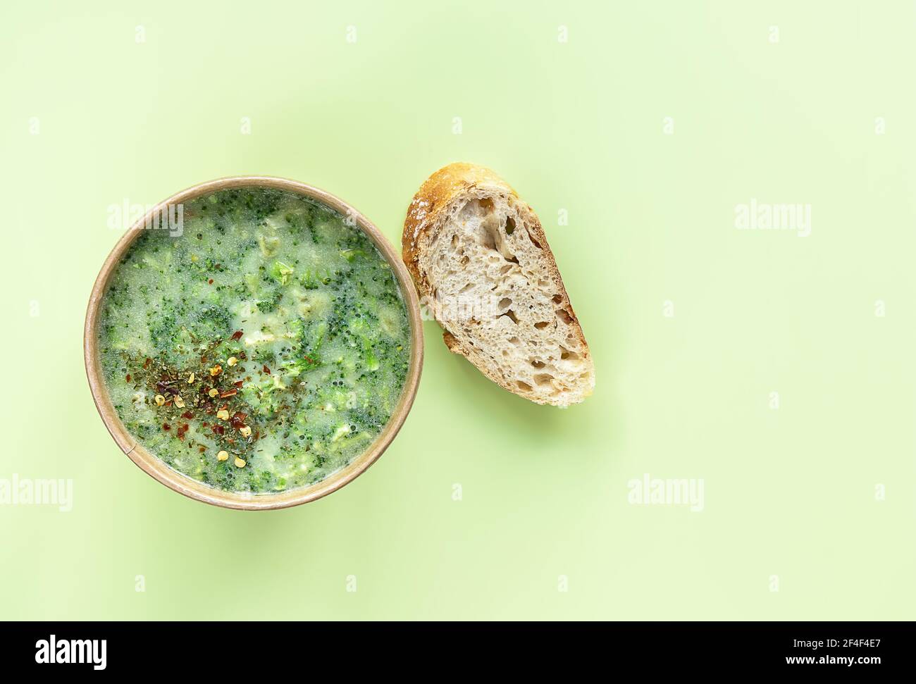 Healthy food delivery concept. Fresh broccoli cream soup served fresh