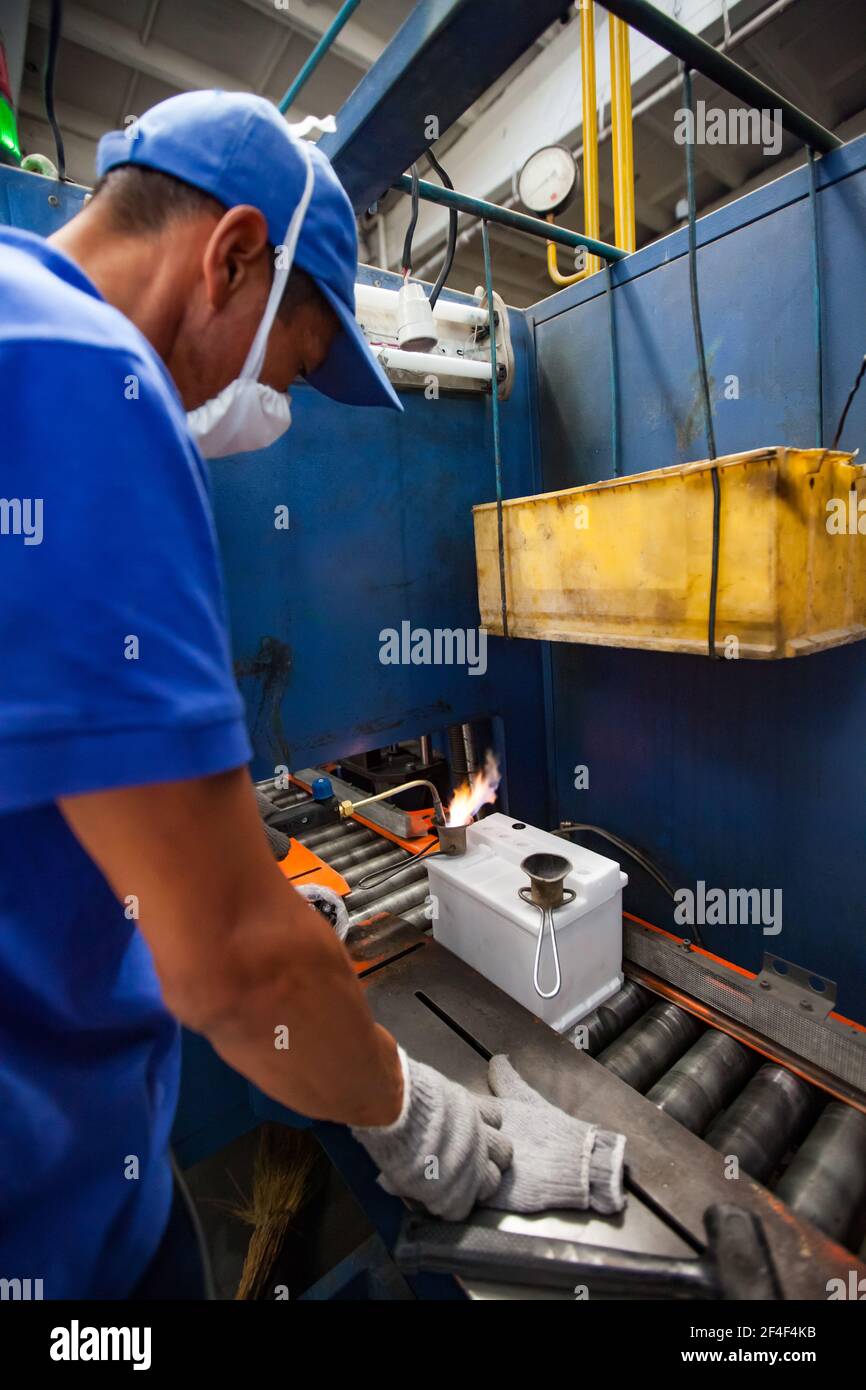 Taldykorgan, Kazakhstan - June 06 2012: Accumulator recycling plant Kainar. Foundry plumb storage battery connectors (terminals) Stock Photo