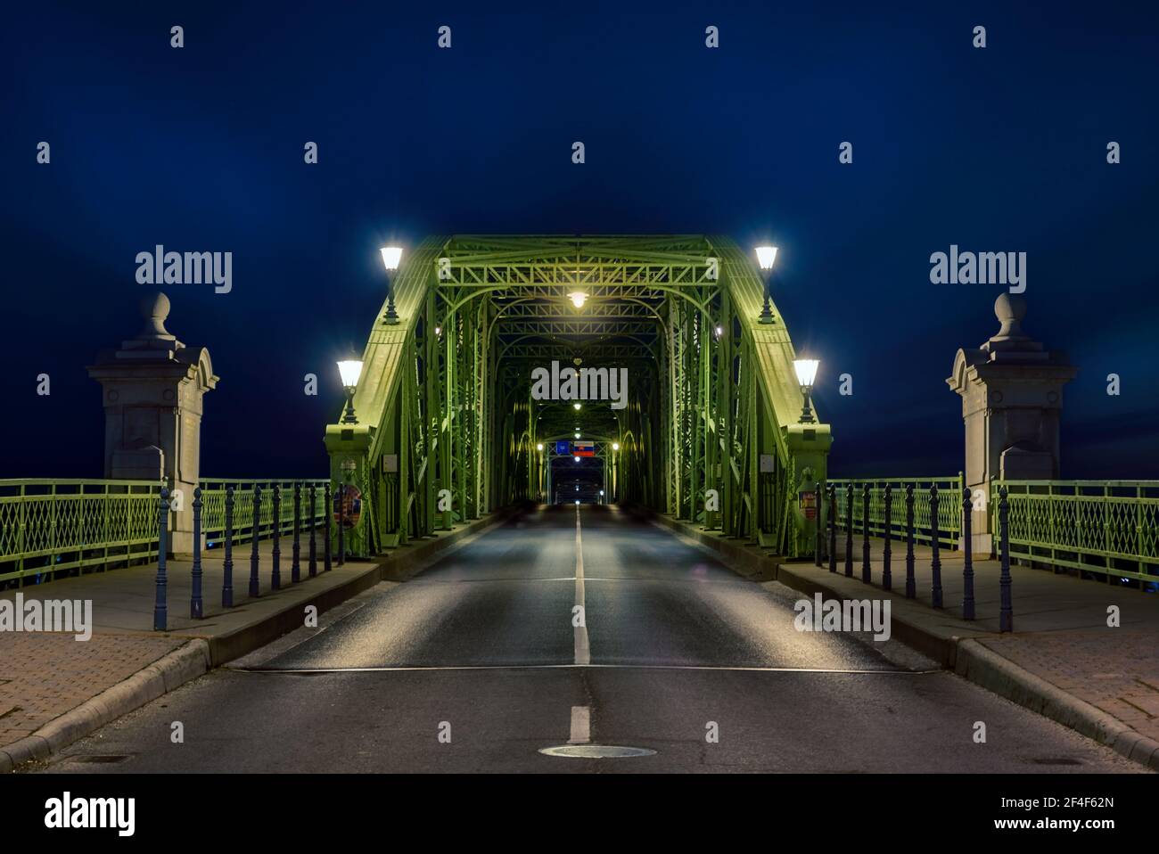 Maria Valeria bridge on the border of Hungary and Slovakia. Amazing evening photo with splendid city lights Stock Photo