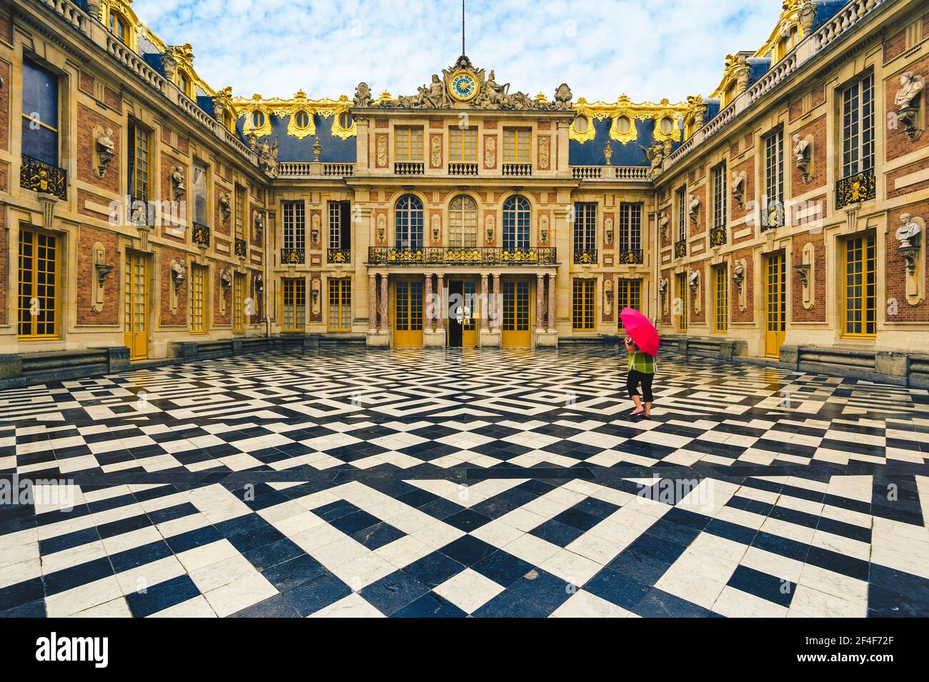 June 18, 2015: Marble Court and facades of the first Chateau in Palace of Versailles, Paris, France. It was embellished by Louis Le Vau in 1661 to 166 Stock Photo